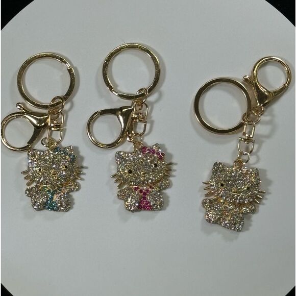 BAG CHARM Hello Kitty Gold Tone Crystal Hair Bow Bag Charm Keychain - Picture 5 of 6